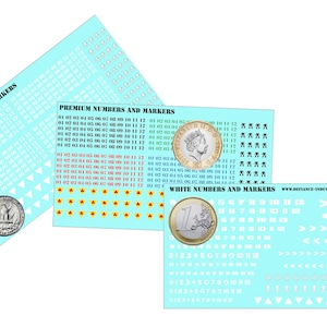 May include: Three sheets of white waterslide decals with various numbers, arrows, and symbols. The decals are for use on model kits and other crafts. The sheets are labeled "Small Numbers and Markers", "Premium Numbers and Markers", and "White Numbers and Markers".