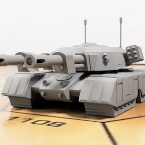 May include: A gray, detailed model of a tank with two large cannons on the front and a smaller turret on the back. The tank is sitting on a wooden surface.