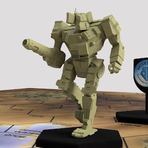 May include: A beige plastic model of a robot with a large gun in its right hand. The robot is standing on a black base and is posed in a walking position. The robot is on a brown and beige hexagonal game board.