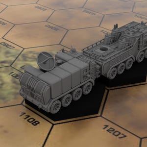 May include: A grey, detailed model of a futuristic military vehicle with a large, round antenna on the front and a smaller, boxy trailer attached to the back. The vehicle has multiple wheels and appears to be made of metal.