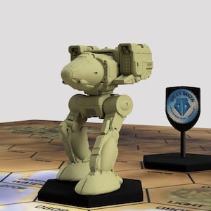 May include: A beige plastic model of a robot with a large, rounded head and a raised arm. The robot is standing on a black base and is surrounded by a hexagonal grid.