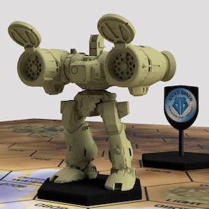 May include: A beige model of a bipedal robot with large missile launchers on its shoulders. The robot stands on a black base, next to a shield-shaped emblem with the text "BRIAN BANZAI". The model is set on a hexagonal game board.