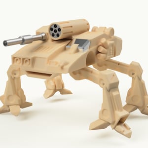 Könnte beinhalten: Ein beigefarbenes, artikuliertes Spielzeug-Militärfahrzeug mit einem sechslöufigen Geschützturm.