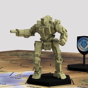 May include: A beige plastic miniature robot with a large gun, standing on a black hexagonal base. The robot is posed in a fighting stance with its gun pointed forward. The robot is standing on a brown and beige hexagonal game board.