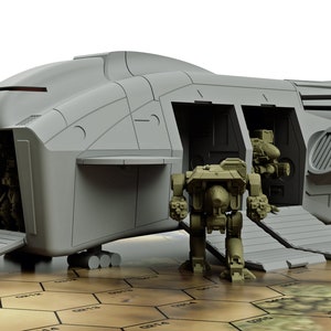 May include: A grey spaceship with a ramp down and two grey and green robots standing on the ramp. The spaceship has a blue and white logo on the side.