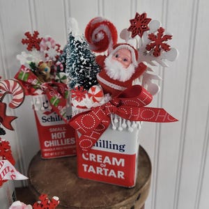 May include: A set of three ceramic mugs with a speckled, matte finish. The mugs are in shades of cream, light gray, and dark gray. Each mug has a simple, minimalist design, perfect for coffee or tea.