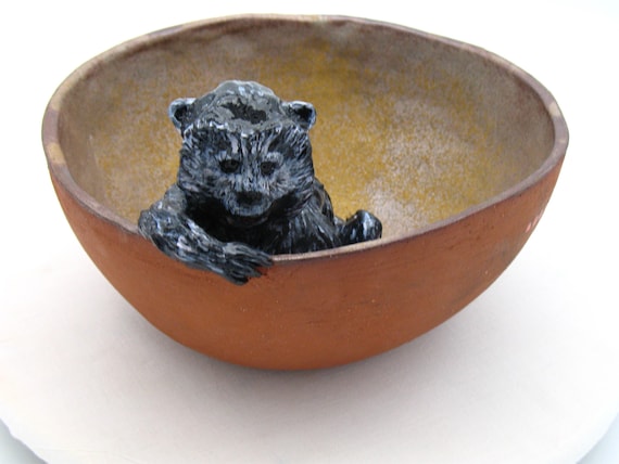 Bowl with monkey, banana peel