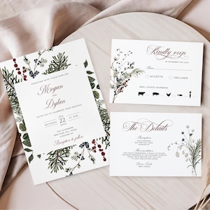 May include: Wedding stationery set with a main invitation, RSVP card, and details card. The design incorporates floral and botanical illustrations in green, burgundy, and blue. The invitation includes names, date, time, and location.