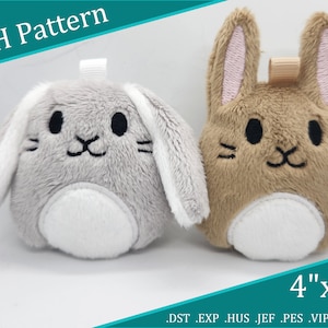May include: Two plush bunny toys, one gray and one brown, with white fur accents. Both are 4 inches by 4 inches and have embroidered faces. The text "ITH Pattern" is in the top left corner of the image. The text ".DST .EXP .HUS .JEF .PES .VIP .XXX" is in the bottom right corner of the image.