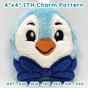 May include: A 4" x 4" in-the-hoop (ITH) embroidery pattern for a penguin charm with a blue bow tie. The pattern is available in DST, EXP, HUS, JEF, PES, VIP, and XXX formats.