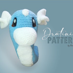 May include: A blue and white crocheted Dratini Pokemon amigurumi pattern. The pattern is in English.