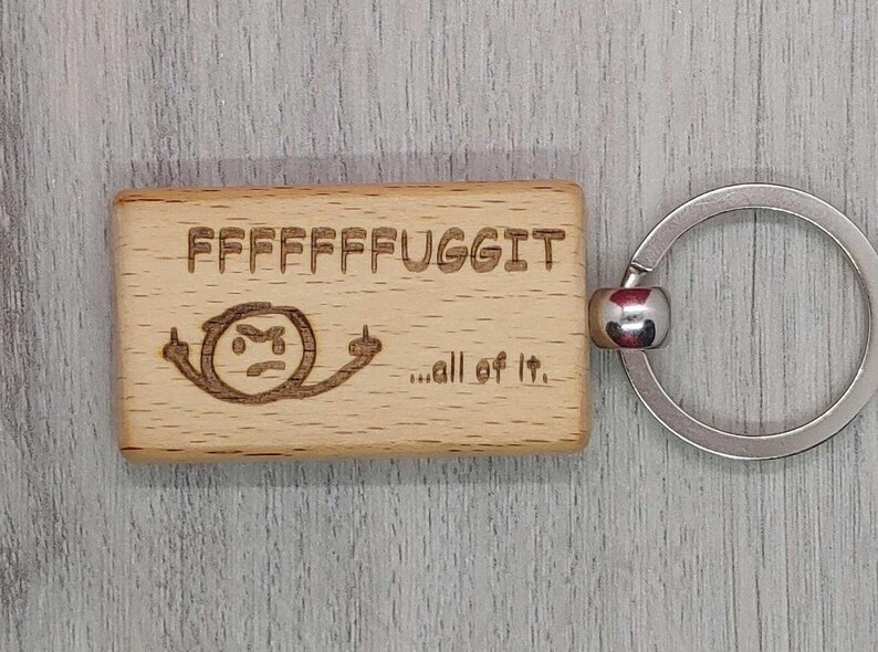 Fuggit with little mean stick figure keychain