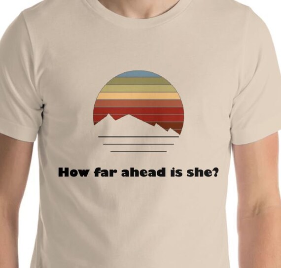 How Far Ahead Is She? T-Shirt – Funny Hiking Party Shirt – Retro Trail Humor Tee for Outdoorsy Couples & Adventure Groups