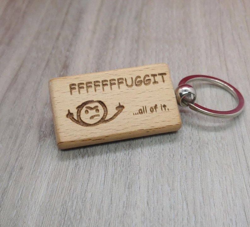 Fuggit with little mean stick figure keychain