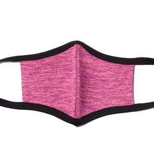 May include: A pink and black face mask with a black elastic band. The mask is made of a soft, breathable fabric.