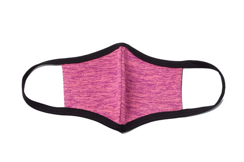 May include: A pink and black face mask with a black elastic band. The mask is made of a soft, breathable fabric.