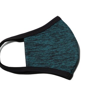 May include: A teal blue face mask with a black trim. The mask has a textured, marbled pattern.