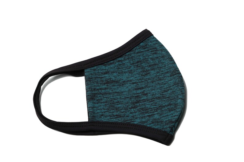 May include: A teal blue face mask with a black trim. The mask has a textured, marbled pattern.
