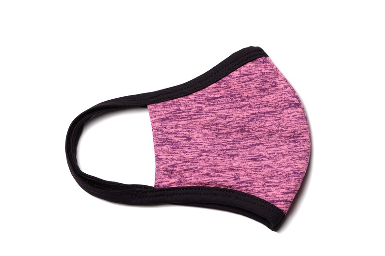 May include: A pink and black face mask with a black elastic band. The mask is made of a soft, breathable fabric.