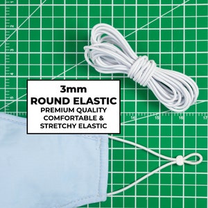May include: A roll of white 3mm round elastic on a green cutting mat. The elastic is labelled "3mm ROUND ELASTIC PREMIUM QUALITY COMFORTABLE & STRETCHY ELASTIC".