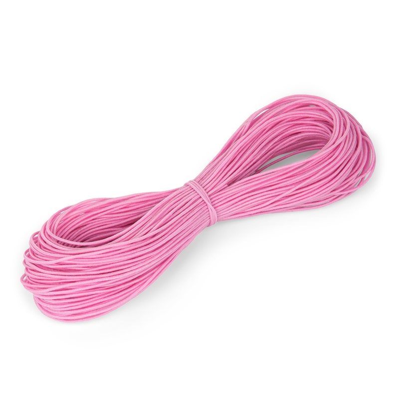 May include: A bundle of pink cord, tightly wound and secured in the middle. The cord is a vibrant shade of pink, and the texture appears smooth. The cord is likely used for crafting or decorative purposes.