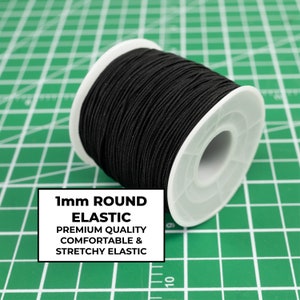 May include: A spool of 1mm round black elastic cord. The label reads "1mm ROUND ELASTIC PREMIUM QUALITY COMFORTABLE & STRETCHY ELASTIC".