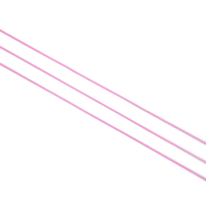May include: Three pink plastic straws on a white background.