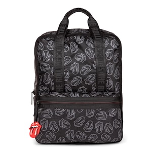 May include: Black backpack featuring a repeating gray tongue logo pattern. The bag has a top handle, shoulder straps, and a front zipper pocket. A red tongue charm hangs from the zipper. The words "THE ROLLING STONES" are printed on the straps.