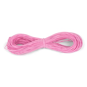May include: A spool of pink elastic cord, perfect for crafting projects.