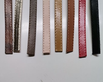 May include: Nine different colors of leather cord, each with a stitched edge. The colors are brown, gold, gray, pink, tan, orange, red, and black.