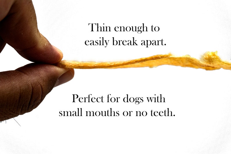 May include: A hand holds a thin, golden-brown dog treat that is easily broken apart. The text "Thin enough to easily break apart. Perfect for dogs with small mouths or no teeth." is below the treat.
