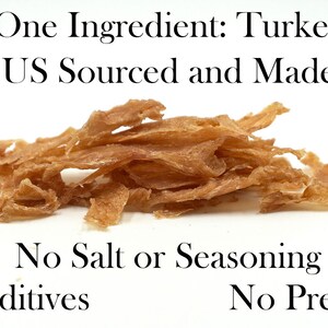 May include: A pile of light brown turkey jerky. The text "One Ingredient: Turkey US Sourced and Made" is above the jerky. The text "No Salt or Seasoning No Additives No Preservatives" is below the jerky.