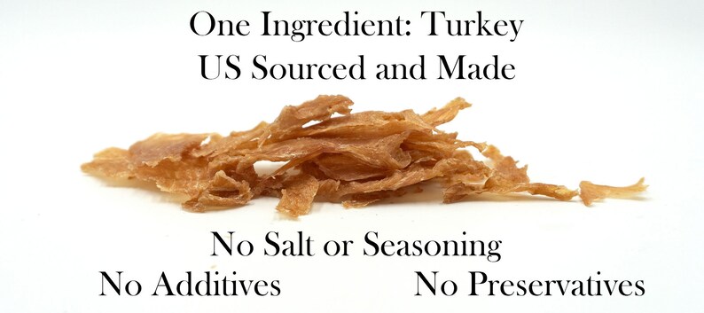 May include: A pile of light brown turkey jerky. The text "One Ingredient: Turkey US Sourced and Made" is above the jerky. The text "No Salt or Seasoning No Additives No Preservatives" is below the jerky.