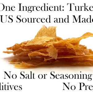 May include: A pile of dried turkey meat, with the text "One Ingredient: Turkey US Sourced and Made No Salt or Seasoning No Additives No Preservatives".