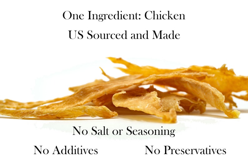 May include: A pile of thin, light brown chicken jerky strips. The text "One Ingredient: Chicken US Sourced and Made" is above the jerky. The text "No Salt or Seasoning No Additives No Preservatives" is below the jerky.