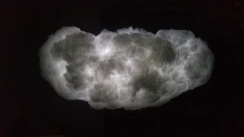 May include: A white cloud-shaped lamp with a soft, glowing light.