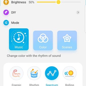 May include: A smartphone screen displaying a Govee app with a brightness slider set to 50%, a DIY option, and a Mode option with three choices: Music, Color, and Scenes. The Music option has a sub-menu with four choices: Energic, Rhythm, Spectrum, and Rolling. Each choice has a corresponding color square.