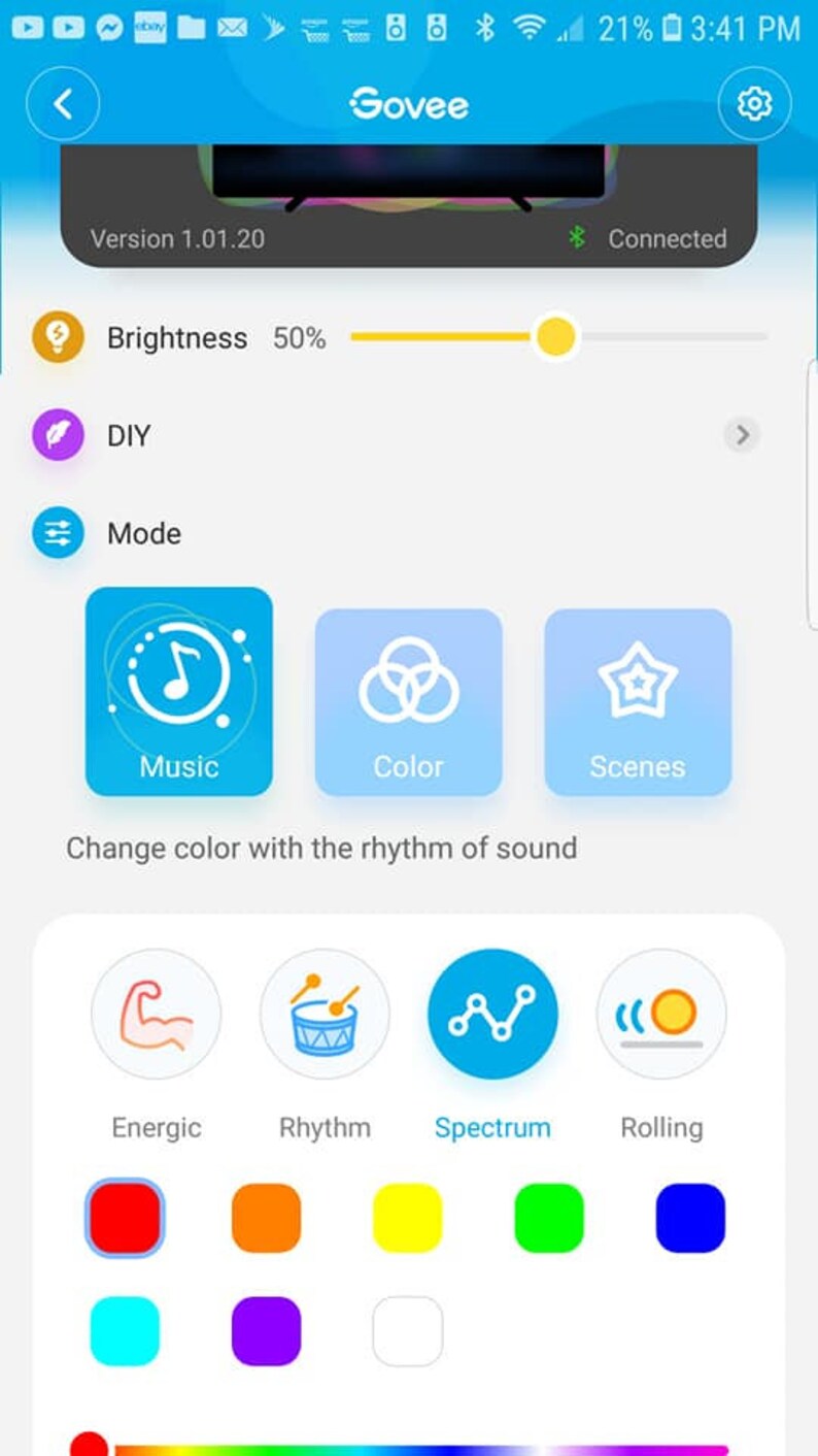 May include: A smartphone screen displaying a Govee app with a brightness slider set to 50%, a DIY option, and a Mode option with three choices: Music, Color, and Scenes. The Music option has a sub-menu with four choices: Energic, Rhythm, Spectrum, and Rolling. Each choice has a corresponding color square.
