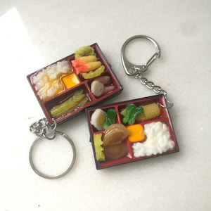 Bento box sushi japon porte-clés, réaliste kawaii nourriture mignon porte-clés, boîte de nourriture unique pour les amateurs de manga anime asie, cadeau porte-clés de charme alimentaire