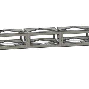 May include: A gray rack-mount frame consisting of three connected rectangular compartments. Each compartment features an open front and a structural lattice base. The unit includes mounting holes on the far left and right vertical flanges.