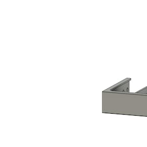 May include: A gray plastic case with a cutout for a small electronic device. The case has a label that says "Prototype".