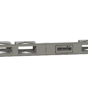 May include: A gray, elongated, rectangular rack-mount panel featuring four distinct rectangular cutouts. The panel has a flat, smooth surface with mounting holes on each end and a central section containing a small, recessed, multi-port connector interface.