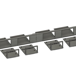 May include: A set of gray metal brackets and mounting plates. The long bracket has multiple rectangular openings. Four smaller plates with square frames are also included. The items are arranged on a white background.