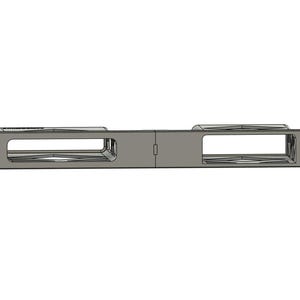 May include: A rectangular, metallic gray object with two rectangular openings and small circular holes on each end. The object appears to be a component or part of a larger mechanism, possibly for mounting or structural support.