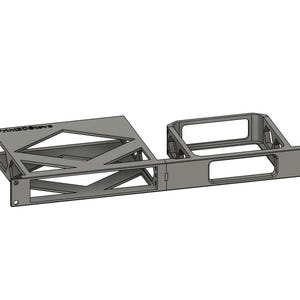 May include: A gray 3D-printed rack mount bracket featuring a geometric open-frame design on the left side and a rectangular cutout on the right side. The text Prim3DStore is embossed on the top left corner of the frame, which includes mounting holes.