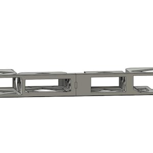 Può includere: Un componente per montaggio a rack in metallo grigio con più aperture rettangolari. Il componente presenta una serie di aperture rettangolari con un design geometrico. Progettato per il montaggio in un rack standard da 48,26 cm.