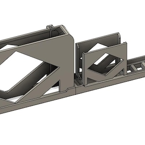 May include: A gray 3D-printed object with a rectangular base and geometric cutouts. The object has a box-like structure on the left, a smaller section in the middle, and a ladder-like design on the right. The text "Print3DSteve" is visible.