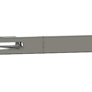 May include: A silver metal rack with a rectangular opening in the center. The rack has a smooth, brushed finish and is designed for mounting.