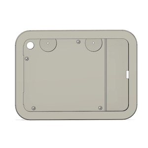 May include: A light grey rectangular object with rounded corners. It has a recessed area with a small door and several circular cutouts. Small screws are visible, and the design is minimalist and functional.