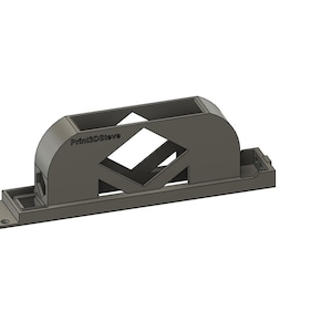 Puede incluir: Un objeto gris oscuro impreso en 3D con una base rectangular y una parte superior arqueada. La parte superior presenta un recorte en forma de diamante y el texto "Print3DSteve". El objeto tiene un diseño moderno y geométrico.